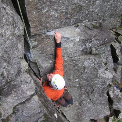 a man climbing on a rock wall