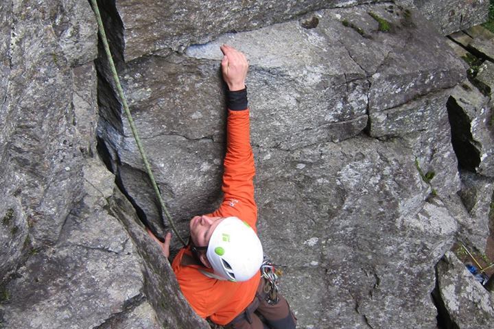 a man climbing on a rock wall