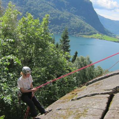 a man standing in front of a mountain