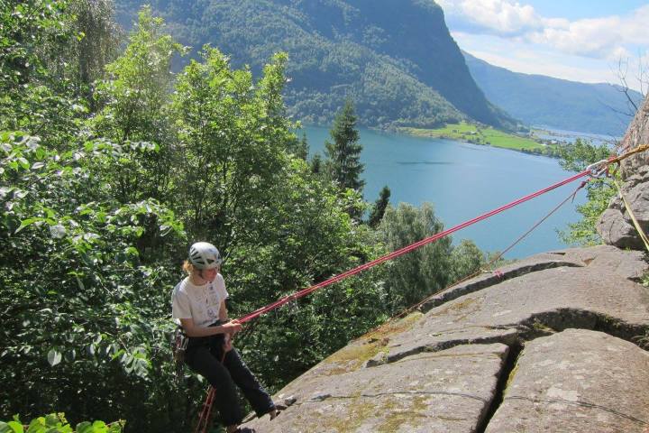a man standing in front of a mountain