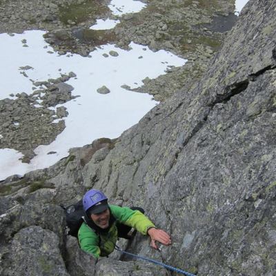 a person standing on a rocky hill