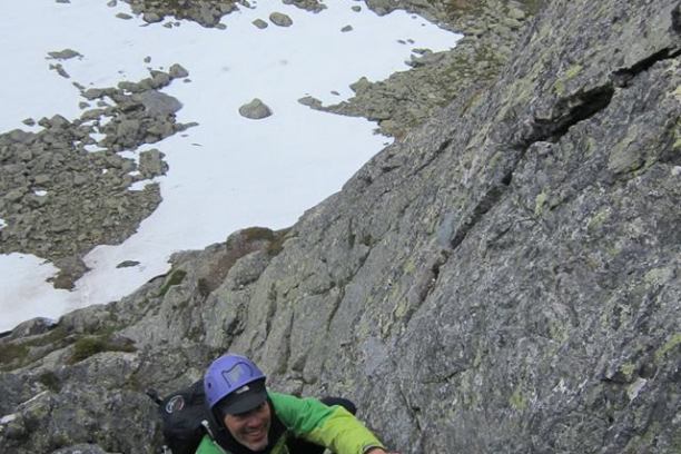 a person standing on a rocky hill