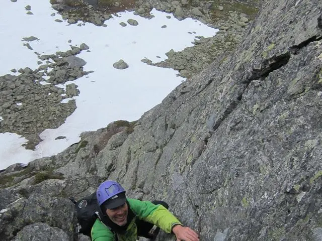 a person standing on a rocky hill