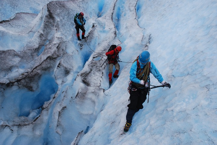 a man riding skis down a snow covered slope