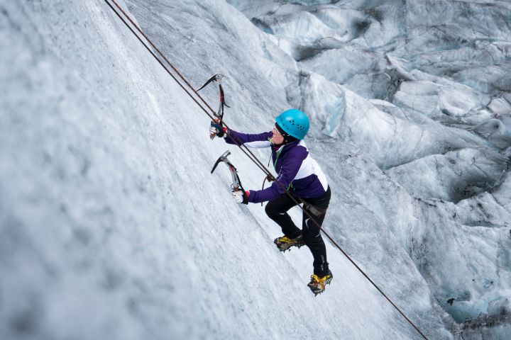 a person riding a skate board in the snow