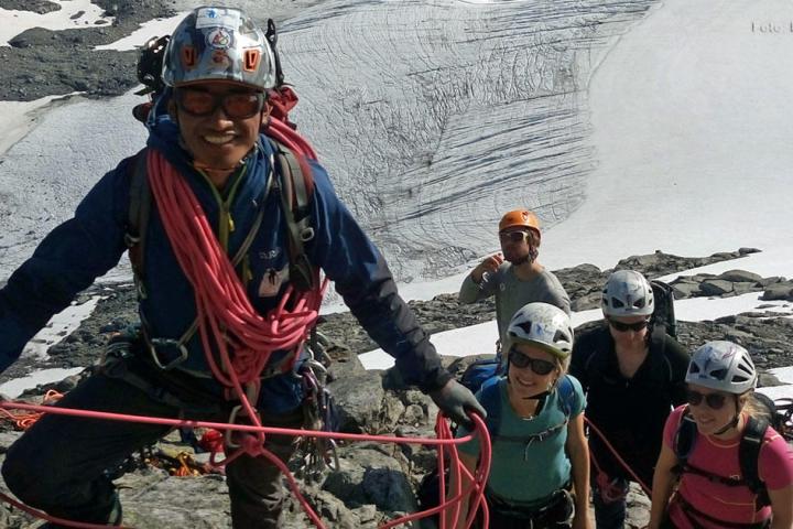 a little boy that is standing in the snow