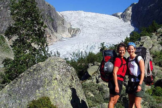 a group of people standing on top of a mountain