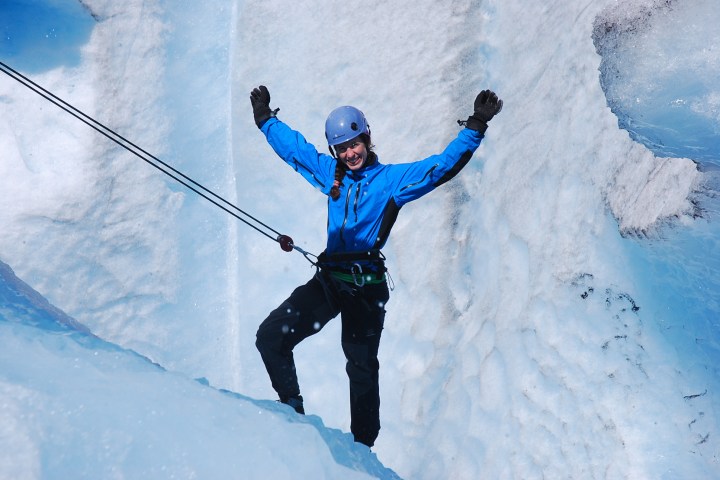a man riding skis down a snow covered slope