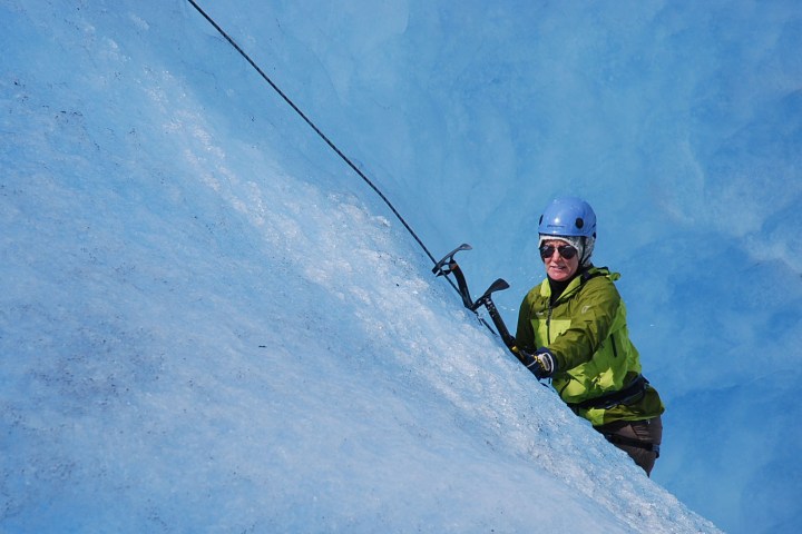 a man riding skis down a snow covered slope