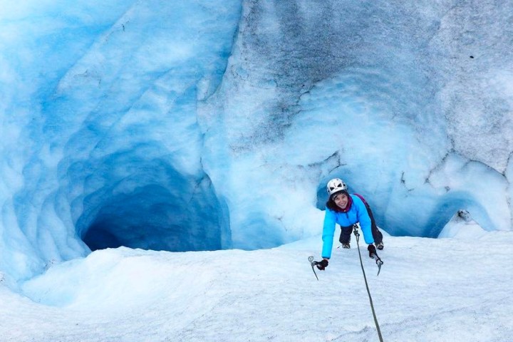 a man riding skis down a snow covered slope