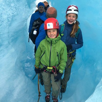 a couple of people that are standing in the snow