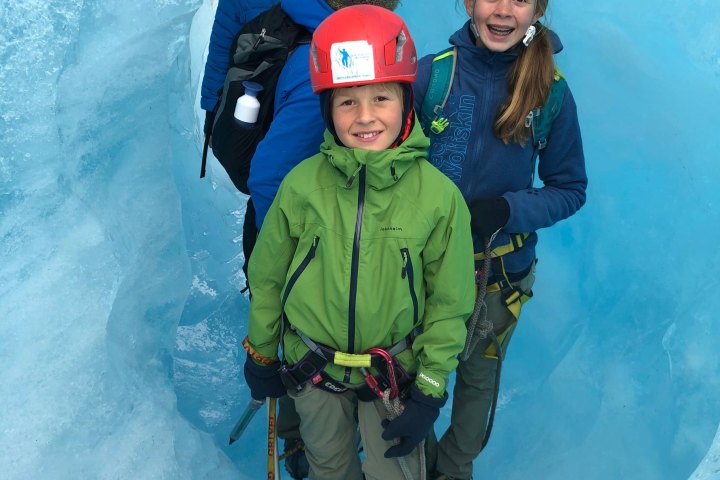 a couple of people that are standing in the snow