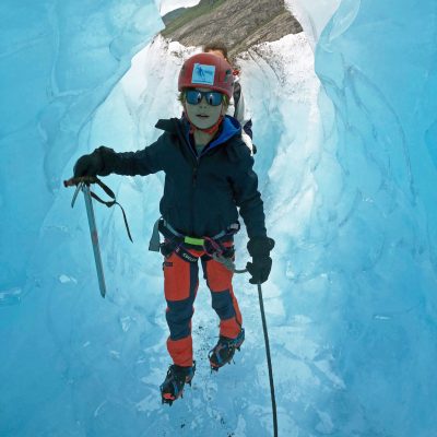 a person skiing down a snow covered mountain