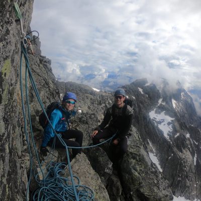 a man standing in front of a mountain