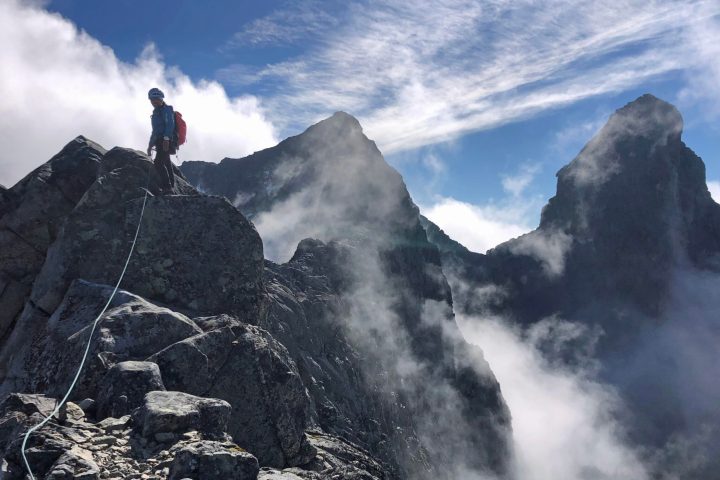 a person standing on a rocky hill